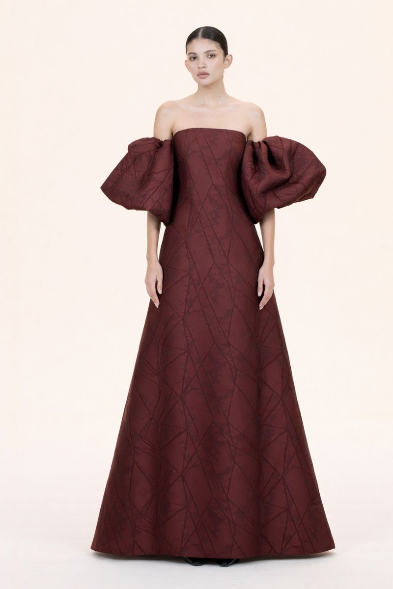 Nihan Peker Mustesna gown with elegant fabric and detailed design, full-length view showing flowing silhouette and intricate details.