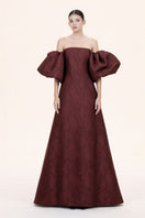 Nihan Peker Mustesna gown with elegant fabric and detailed design, full-length view showing flowing silhouette and intricate details.