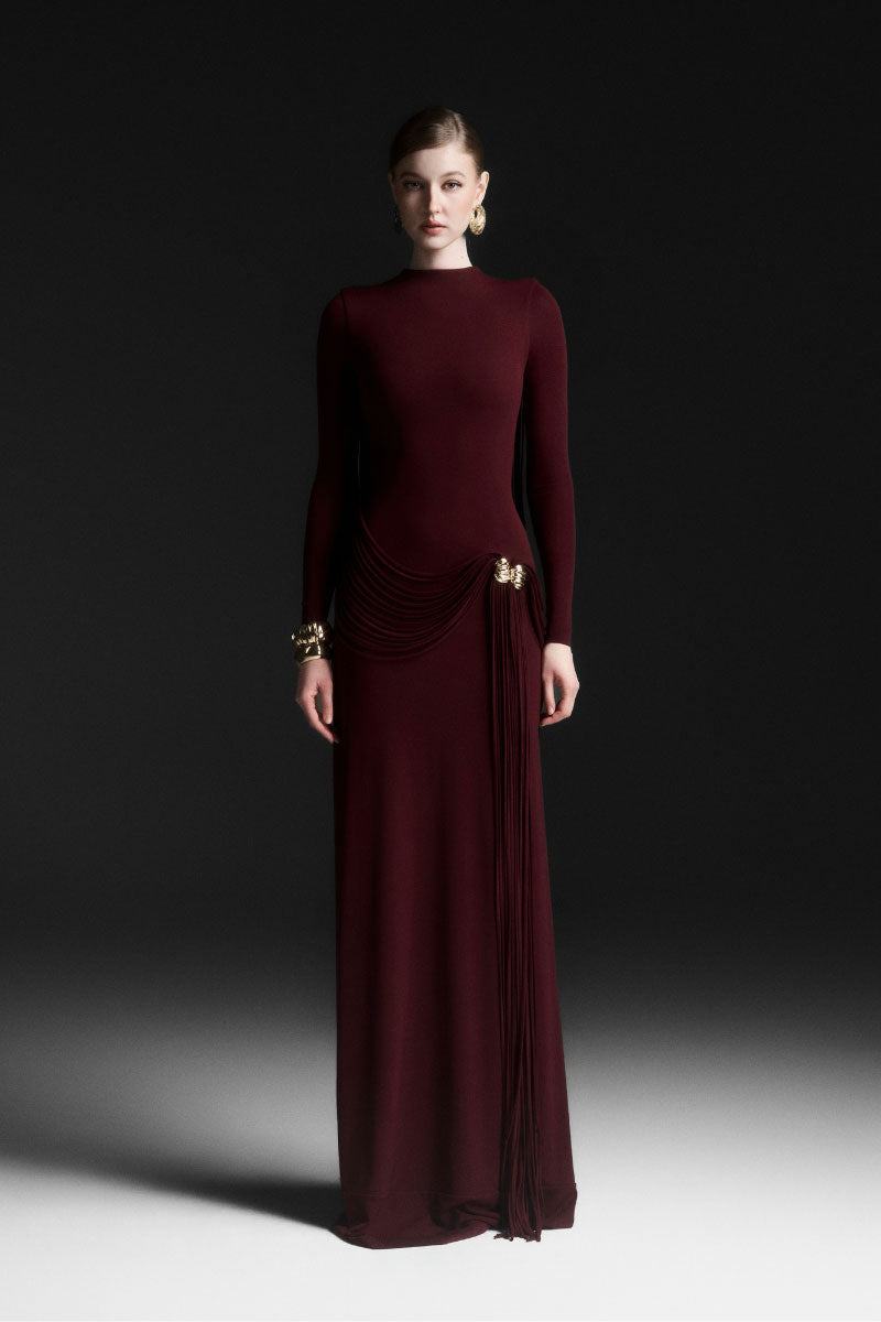 Red Maison Des Copains Corvina draped floor-length gown with elegant flowing fabric and sophisticated design.