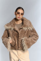 Beige faux fur cropped jacket with turn-up cuffs by Fortini, showcasing soft texture and stylish design.