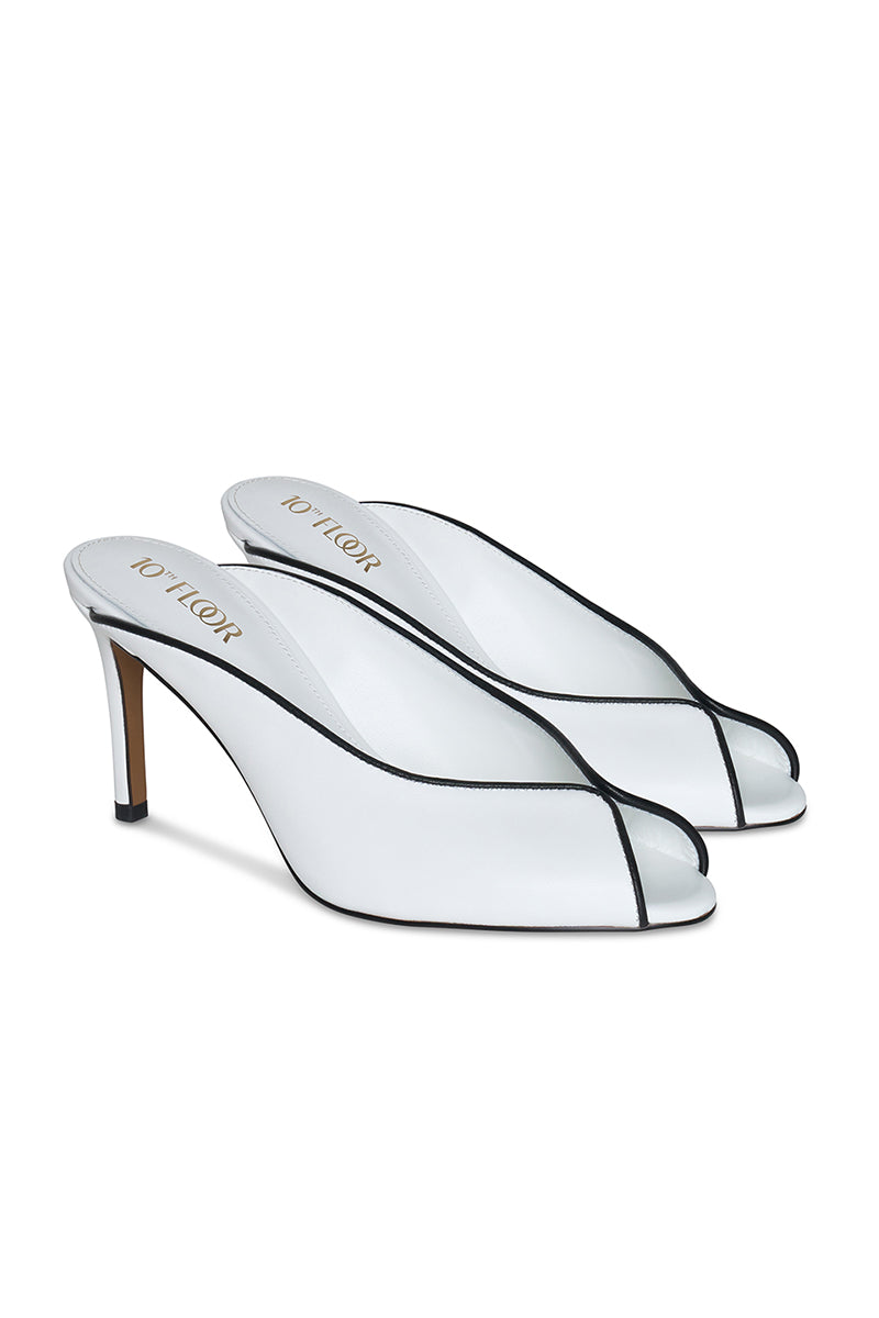 White Riva heel by 10th Floor, stylish women's high heel shoe with sleek design and pointed toe.