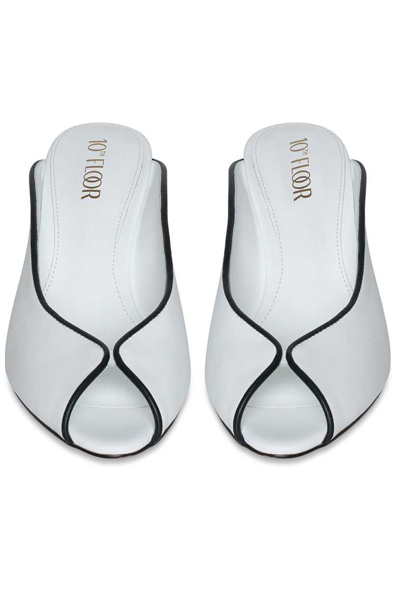 White Riva heel shoes by 10th Floor, stylish women's heels with a sleek design and comfortable heel height.