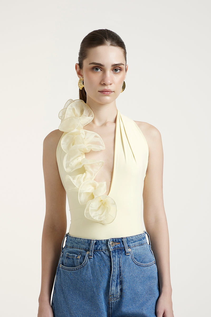 Deme By Gabriella peony yellow top with a flowy design, featuring a round neckline and short sleeves.