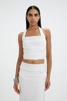 Deme By Gabriella Frances co-ord set featuring a stylish top and matching skirt, displayed in a fashionable outdoor setting.