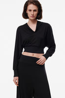 Black hooded longsleeve sweater by Kris Marán, featuring a comfortable fit and casual style.
