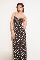 Black Valenciani sweetheart neck spaghetti strap maxi dress, showcasing a fitted bodice and flowing skirt in a stylish design.