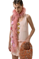 Hand-knitted pink embellished scarf from Lalo, featuring intricate knit patterns and decorative details, perfect for stylish winter wear.