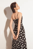 Black Valenciani sweetheart neck spaghetti strap maxi dress with a fitted bodice and flowing skirt, perfect for elegant occasions.