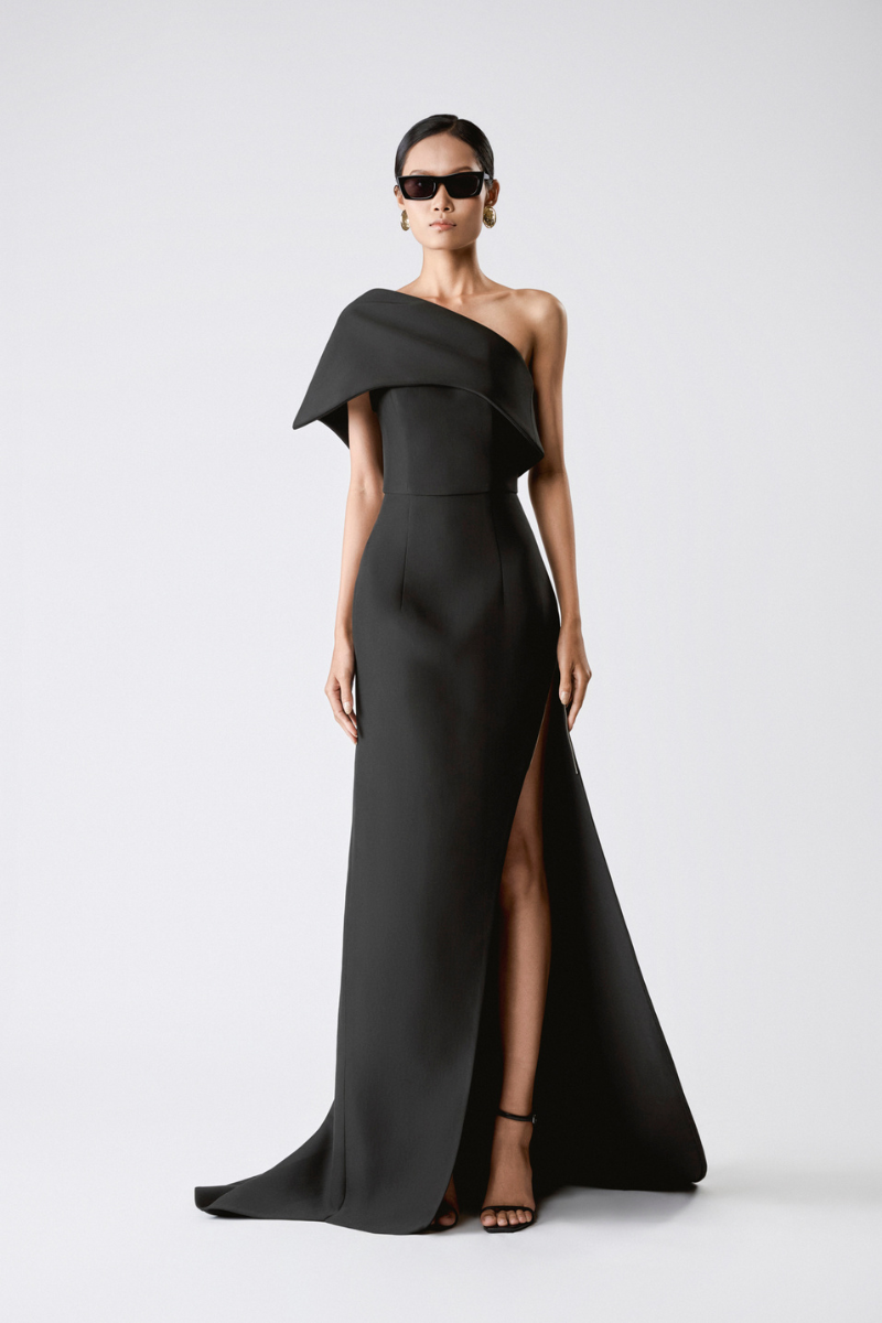 Elegant black Shadow Drape Gown by TONYY showing flowing fabric and draped design on a model.