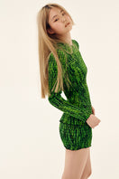 Green printed mini skirt by Chictopia with shirred details, showcased on a model in a stylish fashion pose.