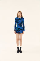 Blue printed mini skirt by Chictopia featuring shirr detailing and a fitted waist, shown on a model.
