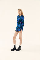 Blue printed mini skirt with shirred design from Chictopia, showcasing a fitted waist and stylish, vibrant pattern.