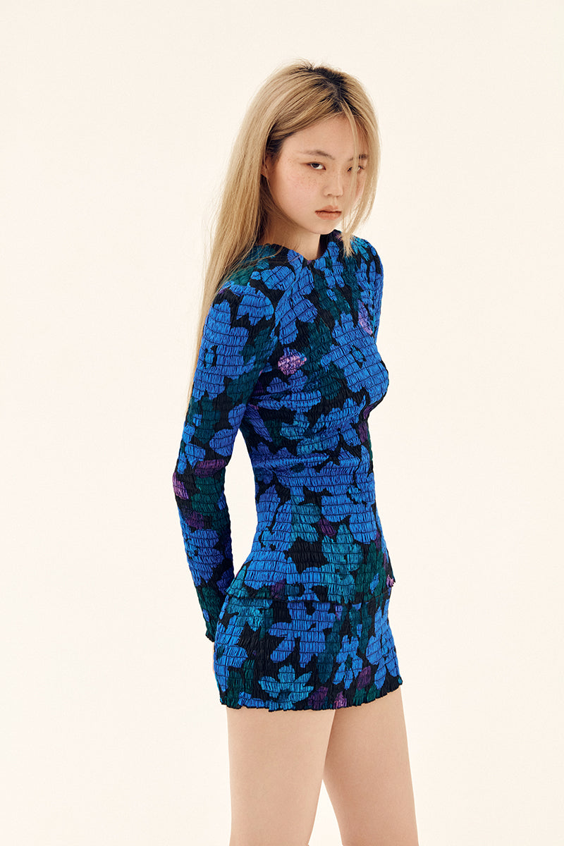 Blue printed mini skirt with shirred detailing from Chictopia, styled with a flowy, casual look.