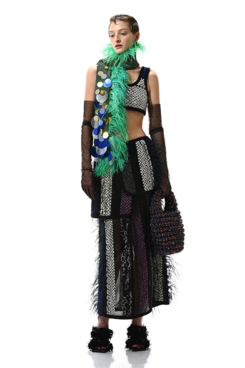 Hand-knitted green embellished scarf by Lalo, featuring intricate knit patterns and decorative details, perfect for stylish warmth.