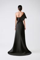 Elegant shadow drape gown by TONYY featuring flowing fabric and a sophisticated silhouette.