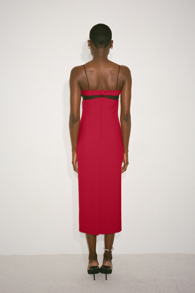 Nué Paloma Midi Dress featuring a flowing silhouette and elegant design, perfect for stylish occasions.