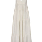 Nelblu Tiemos ecru maxi dress shown on a hanger with flowing fabric and sleeveless design.