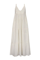 Nelblu Tiemos ecru maxi dress shown on a hanger with flowing fabric and sleeveless design.