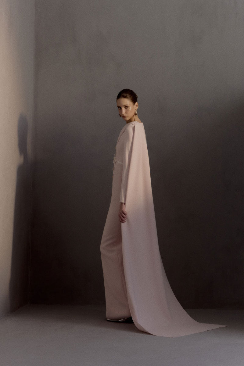 White Plan Miranda gown featuring elegant fabric and intricate design, perfect for formal occasions.