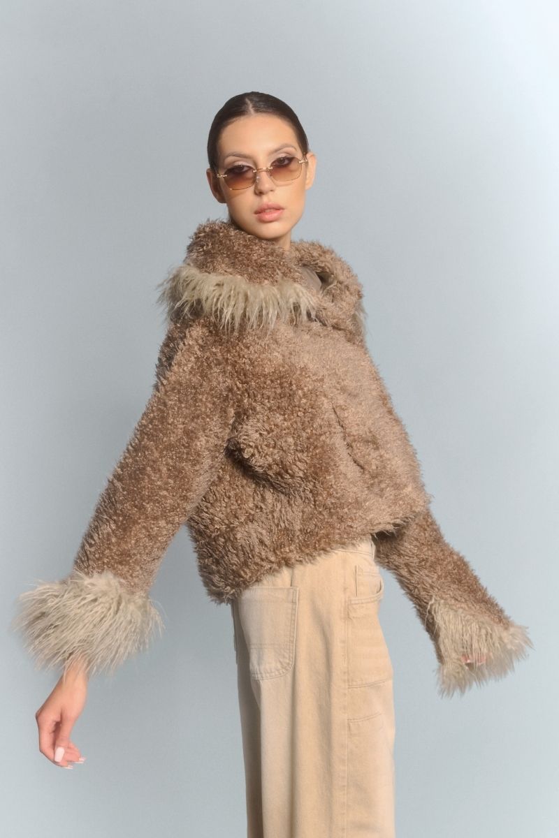 Beige cropped faux fur jacket with turn-up cuffs by Fortini, featuring a soft, plush texture and stylish design.