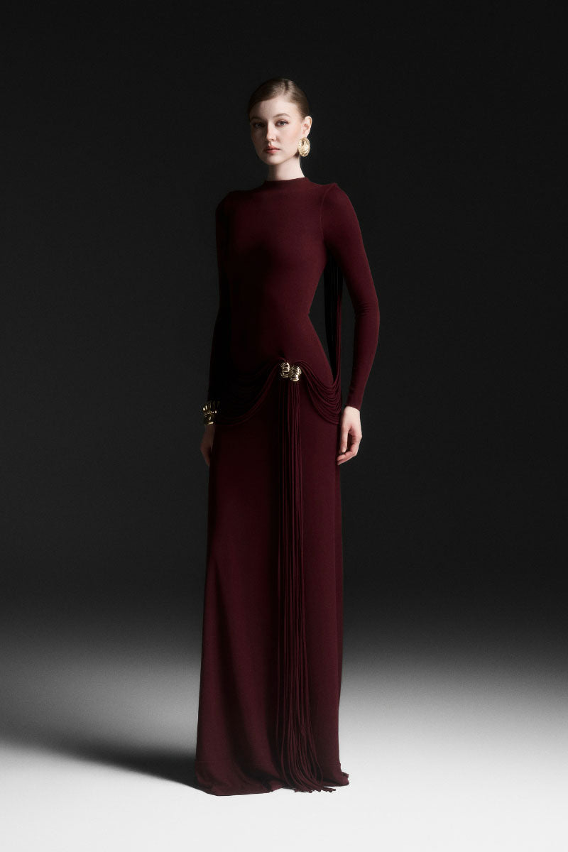 Red Maison Des Copains Corvina draped floor-length maxi dress with elegant flowing fabric and a flattering silhouette.