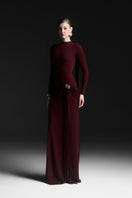 Red Maison Des Copains Corvina draped floor-length gown with elegant flowing fabric and stylish design.