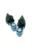 Christin Wu Phoebe tourmaline green mules with block heels and pointed toes, stylish women's slip-on shoes on a neutral background.