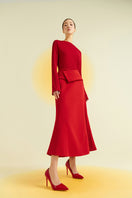 Red spandex midi skirt by EEGEN STUDIO, shown on a model, highlighting the fitted, stretchy fabric and stylish design.