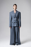 Liya double-breasted charcoal blazer for women, tailored fit with notch lapels and structured design, hanging on a hanger.