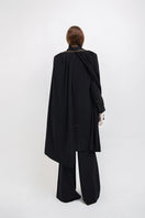 Vaska black long coat with zip-on detachable scarf, stylish and warm outerwear, shown on a model.