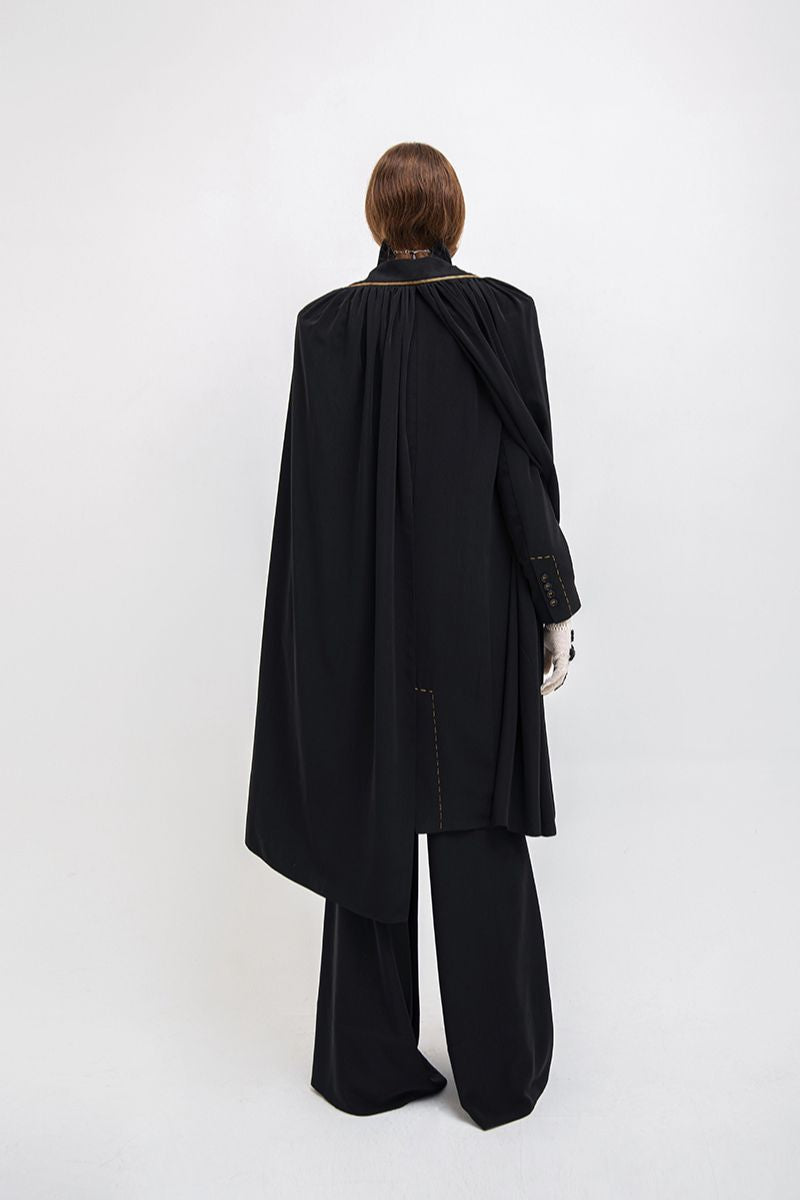 Vaska black long coat with zip-on detachable scarf, stylish and warm outerwear, shown on a model.