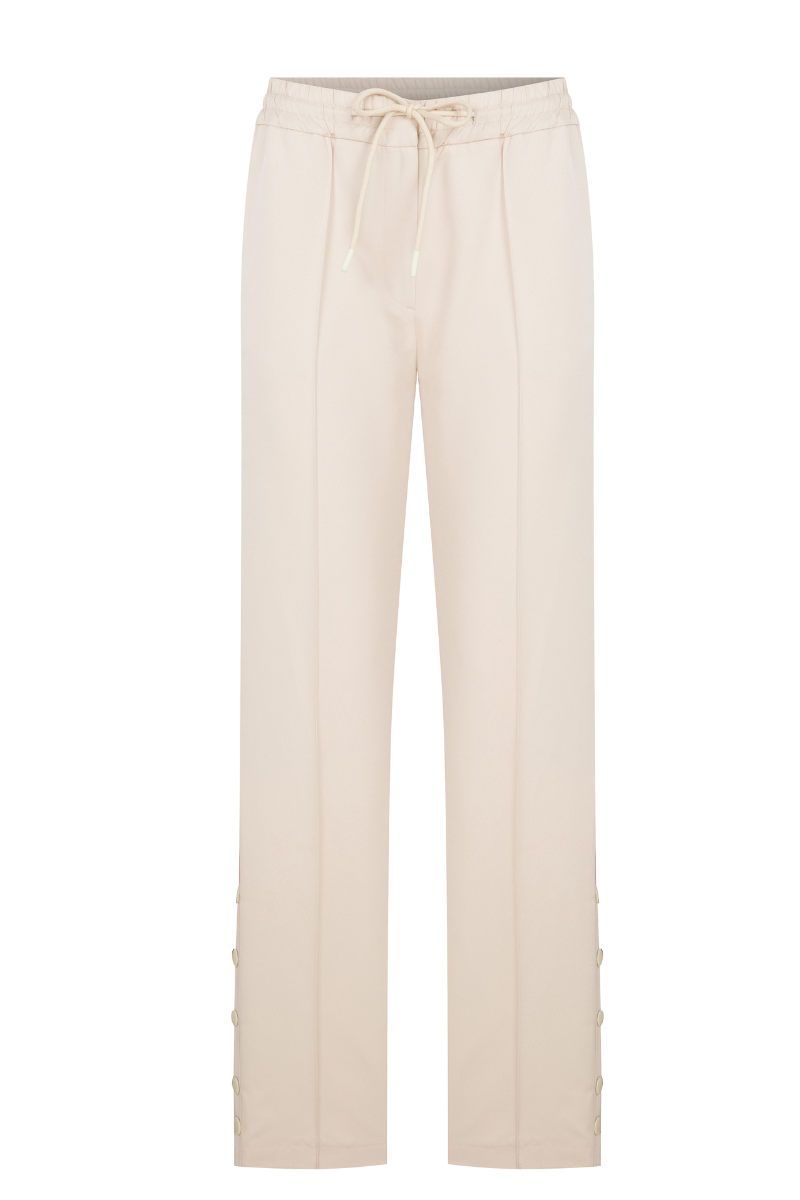 Cream ColoReve sweat pants laid flat showing soft fabric and relaxed fit, perfect for comfortable casual wear.
