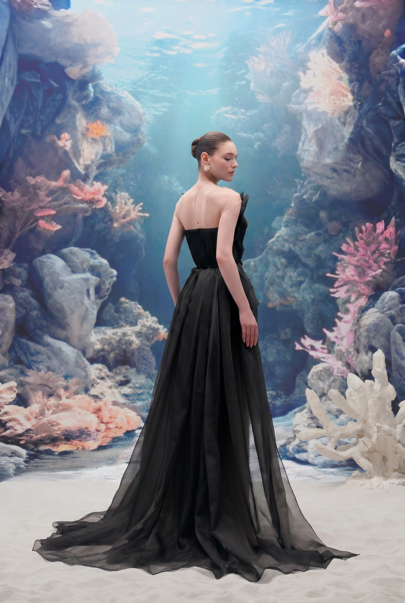 Black SEDNA tulle and organza gown by 21Six, featuring flowing fabric and elegant design, perfect for formal occasions.
