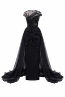 Black Sedna tulle and organza gown by 21Six, featuring a flowing design with delicate fabric details.