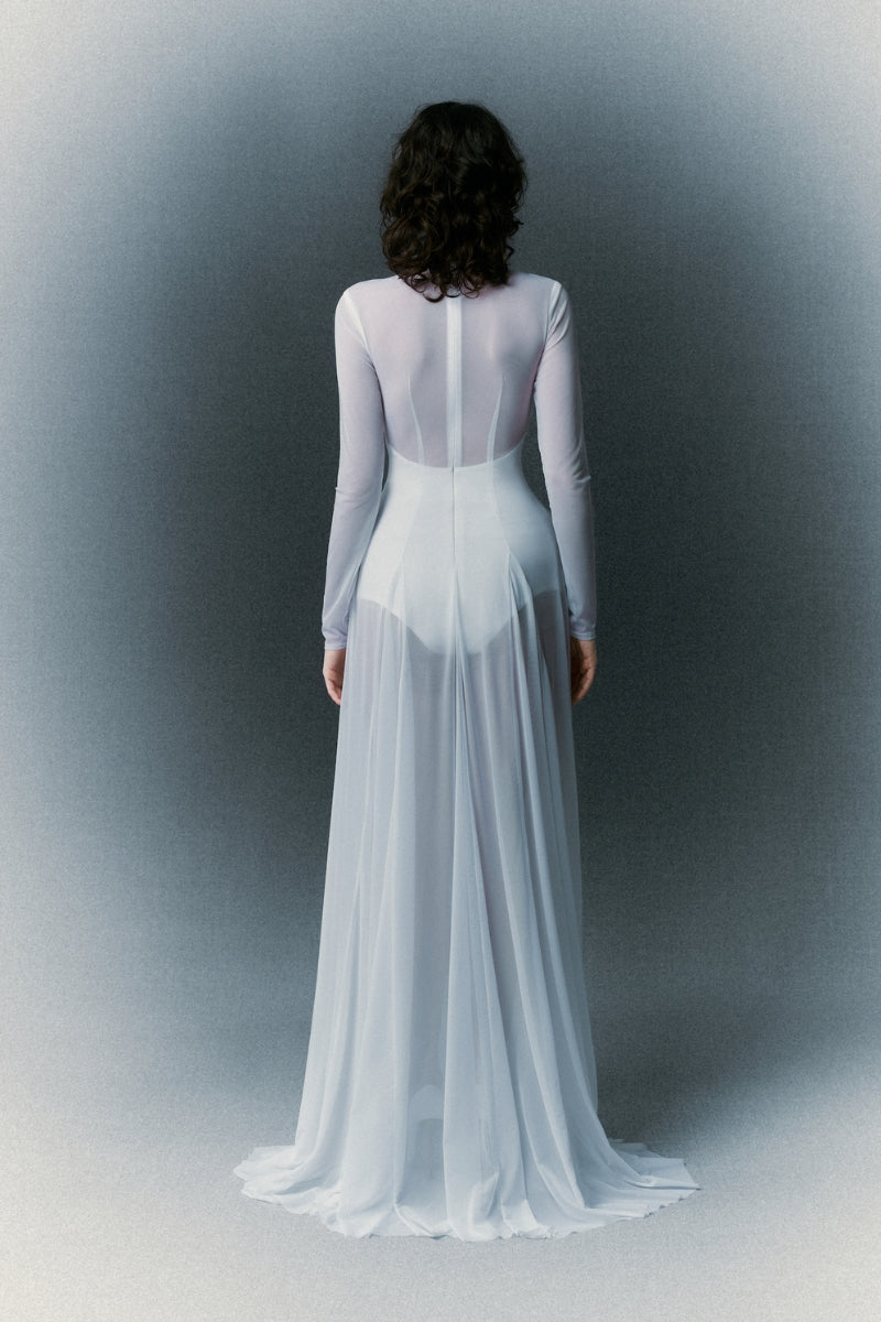 White Plan Nirvana Dress gown with flowing fabric and elegant design, displayed on a mannequin.