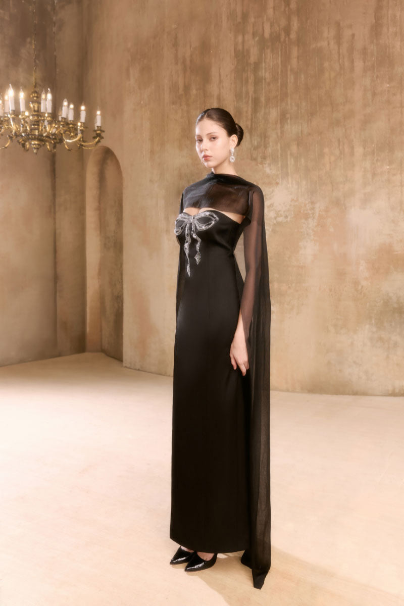 Elegant Arti Apparel gown from the RENTA DRESS collection, featuring flowing fabric and intricate design details.
