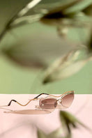 Brown Forget Me Not sunglasses by Moy Atelier featuring stylish frames and tinted lenses for a fashionable look.