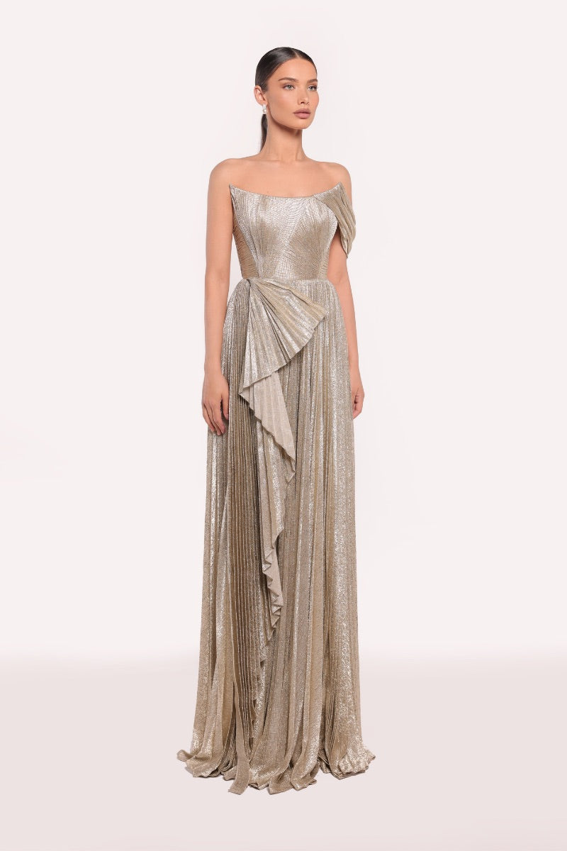Elegant gold gown by Tarık Ediz featuring intricate details, perfect for formal occasions and evening wear.