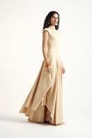 Gold Deme By Gabriella Alette maxi dress with elegant flowing fabric, perfect for formal occasions or summer events.