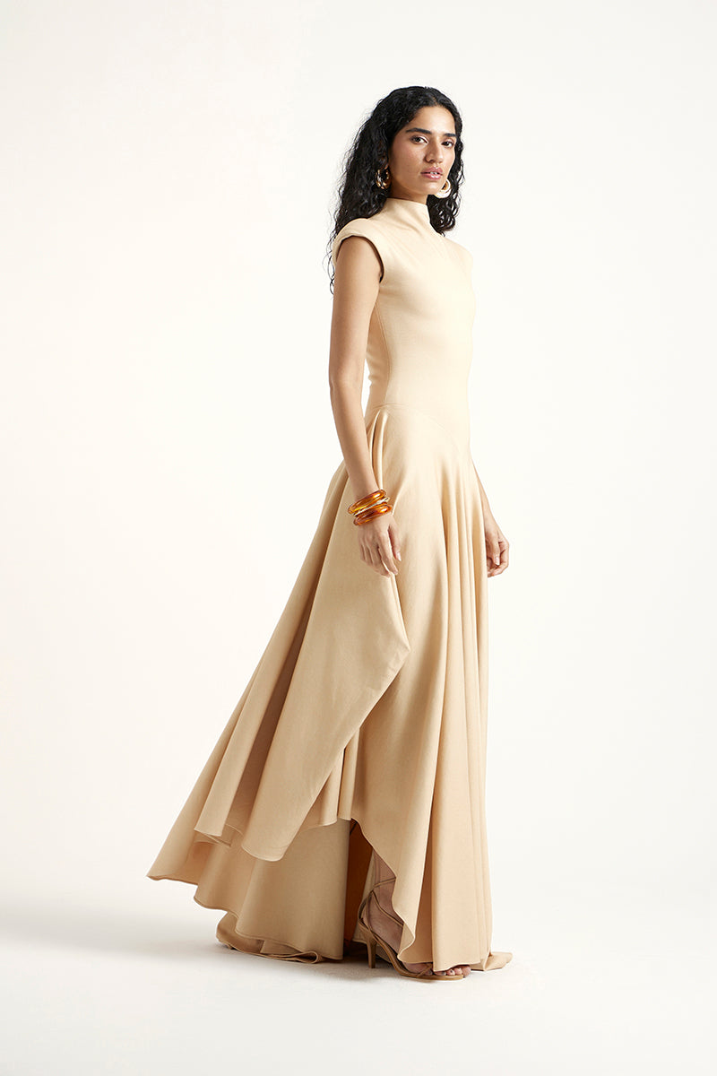 Gold Deme By Gabriella Alette maxi dress with elegant flowing fabric, perfect for formal occasions or summer events.