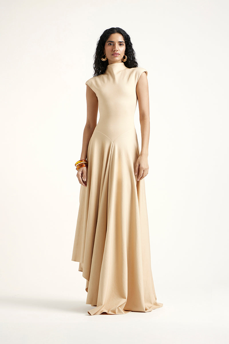 Gold Deme by Gabriella Alette maxi dress with flowing fabric and elegant design, perfect for formal occasions.