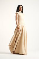 Deme By Gabriella gold maxi dress featuring a flowing silhouette and elegant design, shown in a full-length view.