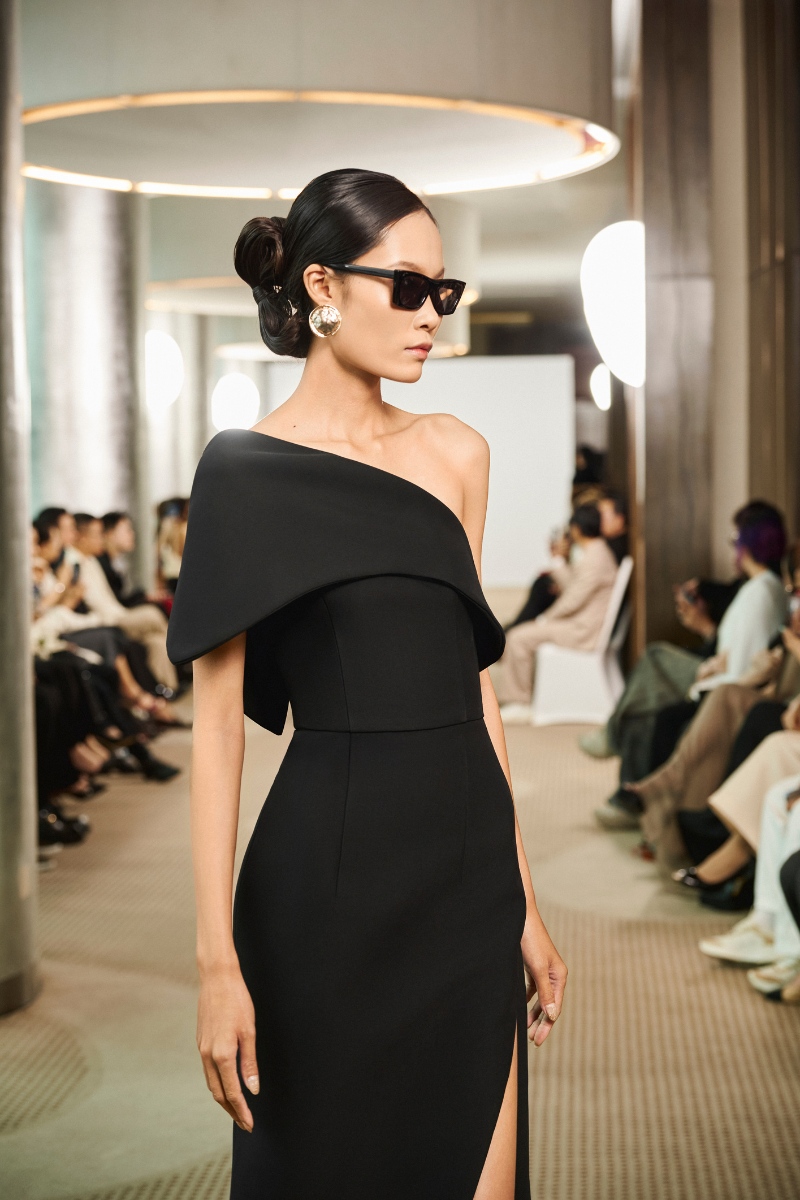 Elegant shadow drape gown by TONYY featuring flowing fabric and a stylish silhouette, perfect for formal occasions.