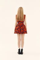 Chictopia sculpted neoprene mini dress in vibrant flora print, form-fitting with sleeveless design and bold pattern.