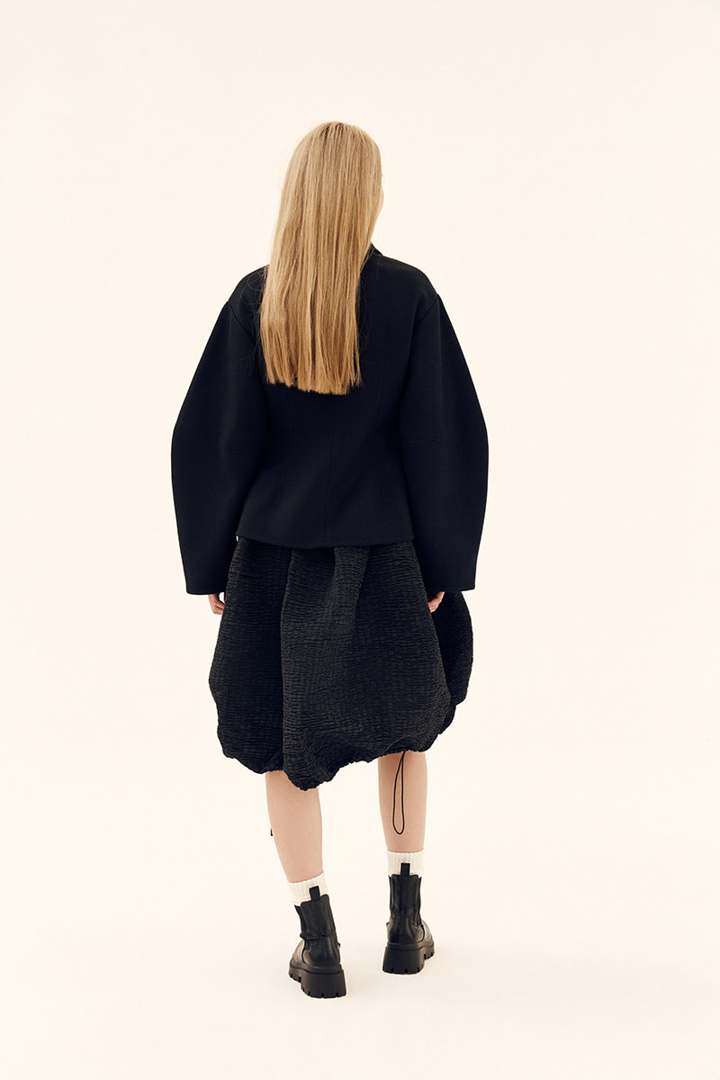 Chictopia sculpted black volume jacket featuring structured design and padded details, perfect for contemporary fashion.