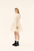Ethereal ivory silk shirred mini dress by Chictopia with delicate ruffle details and a flowing, elegant silhouette.