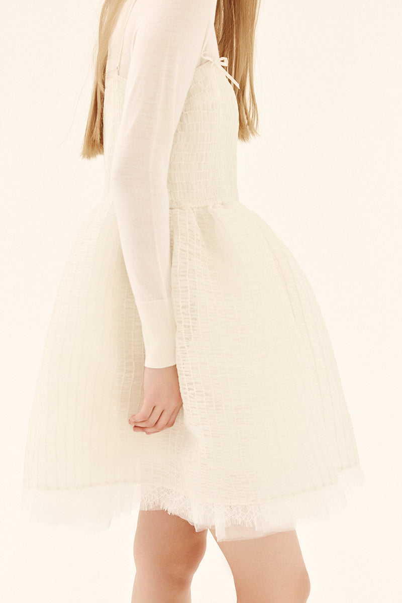 Chictopia ivory ethereal shirred silk mini dress with delicate straps and flowing fabric, perfect for elegant summer occasions.