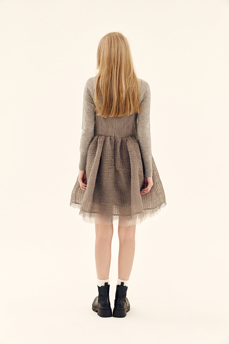 Gray Chictopia Ethereal Shirred Silk Dress, a mini dress with flowing fabric and shirred details, shown on a model.