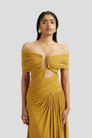 Deme By Gabriella Marisa maxi dress in vibrant ochre yellow, flowing gown with elegant fabric and full-length design.