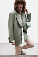 Green PODYH MEREZHYVO jacket, stylish outdoor jacket with a sleek design, perfect for casual wear and outdoor activities.